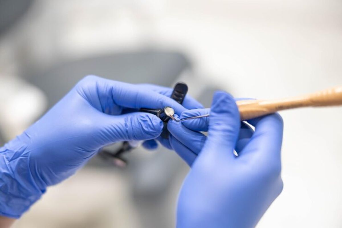 dental professional preparing a custom dental restoration